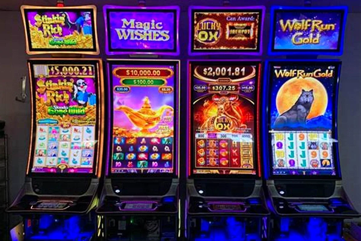 High5 Casino slot lobby with bonus coin stacks